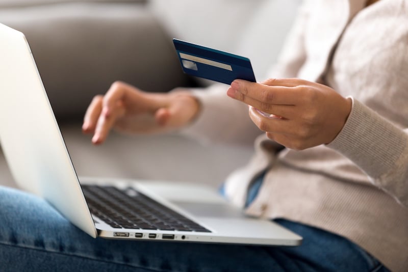 Close up woman shopping, paying by credit card